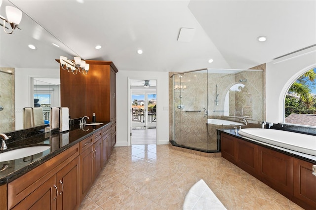 bathroom with a wealth of natural light, vanity, and independent shower and bath