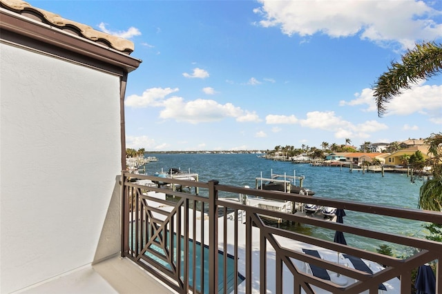 balcony featuring a water view