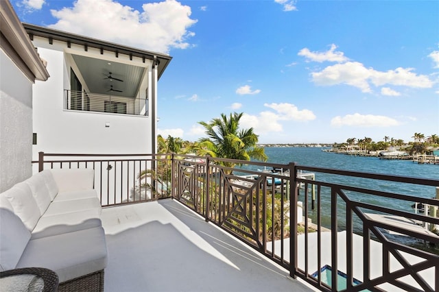 balcony featuring a water view