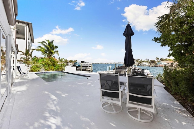 view of swimming pool with a water view