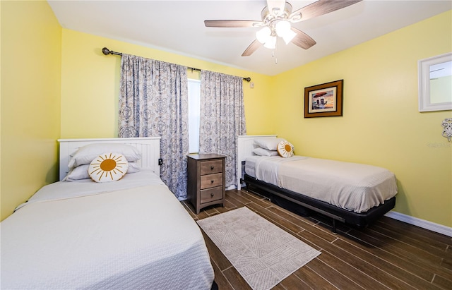 bedroom featuring dark wood-type flooring and ceiling fan