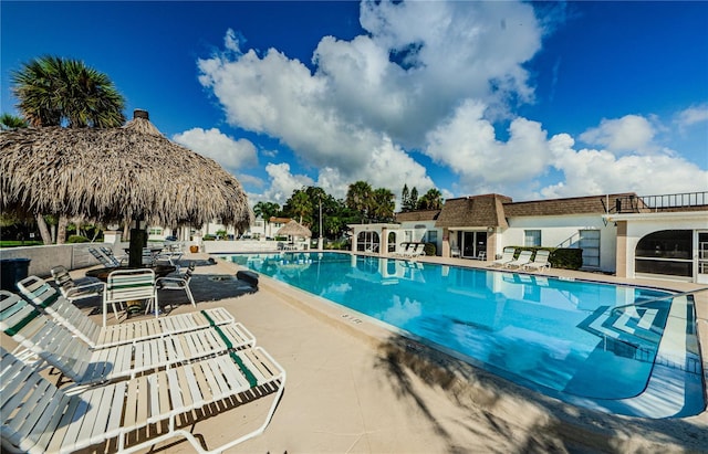 view of swimming pool with a patio