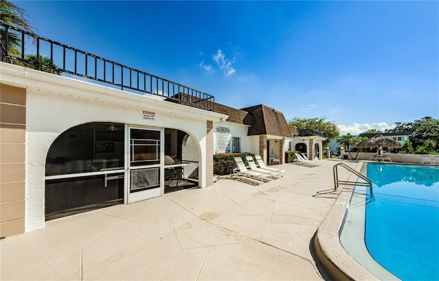 view of swimming pool with a patio area