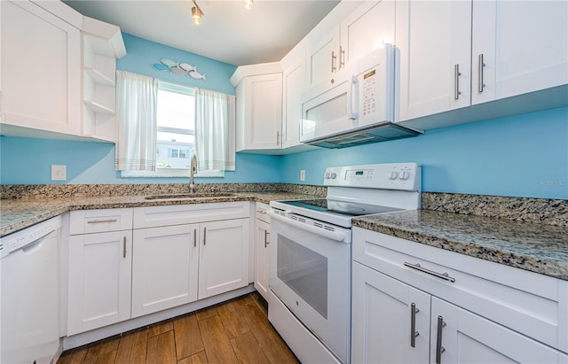 kitchen featuring dark hardwood / wood-style flooring, light stone counters, white cabinets, sink, and white appliances