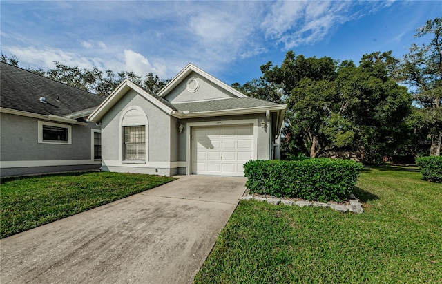 3647 Muirfield Ct, New Port Richey, FL 34655 - ranch-style home featuring driveway, an attached garage, a front lawn, and stucco siding