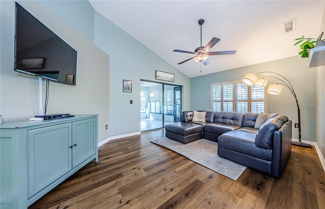 living room with ceiling fan, high vaulted ceiling, and dark hardwood / wood-style flooring