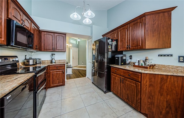 3647 Muirfield Ct, New Port Richey, FL 34655 - kitchen with black appliances, a chandelier, light stone countertops, hanging light fixtures, and light tile patterned floors