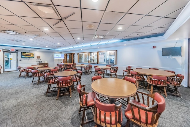 dining space with carpet and crown molding