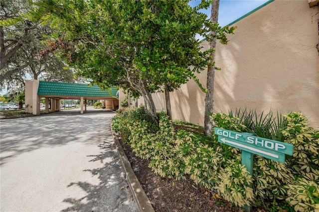 3647 Muirfield Ct, New Port Richey, FL 34655 - exterior view of stucco siding and driveway