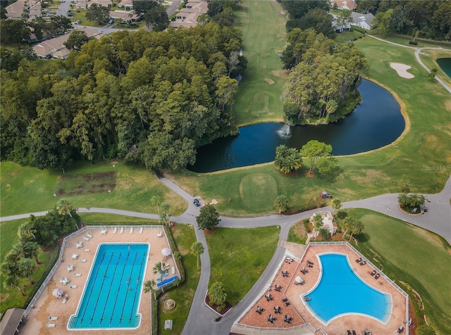3647 Muirfield Ct, New Port Richey, FL 34655 - aerial view of property and surrounding area with a pool, a nearby body of water, and a local golf course