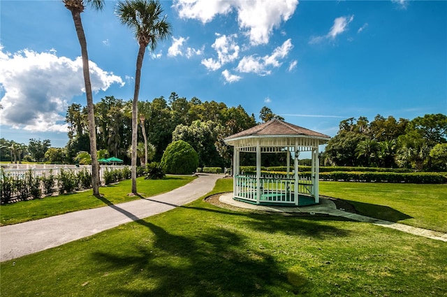 surrounding community with a yard and a gazebo