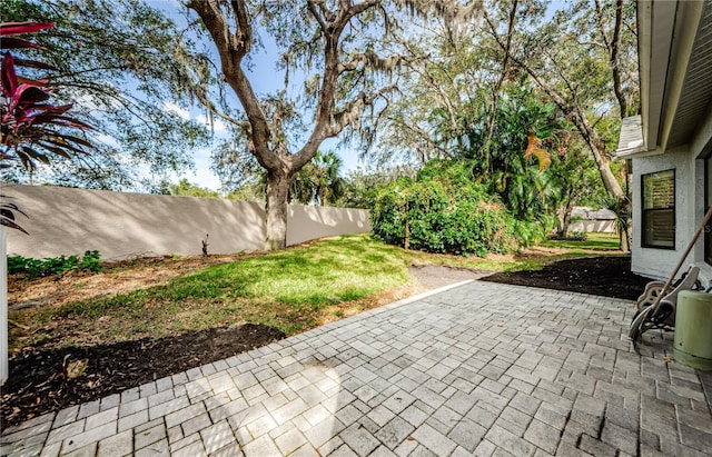 3647 Muirfield Ct, New Port Richey, FL 34655 - fenced backyard featuring a patio area
