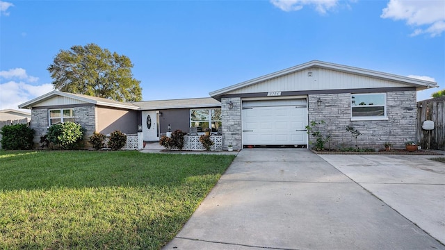 ranch-style house featuring a garage and a front yard