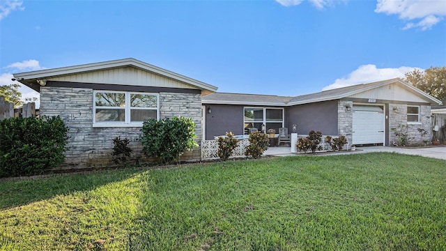 ranch-style home with a garage and a front yard