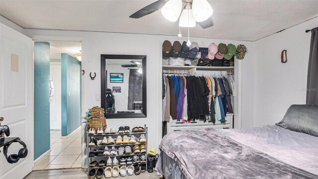 bedroom with a closet, light wood-type flooring, and ceiling fan