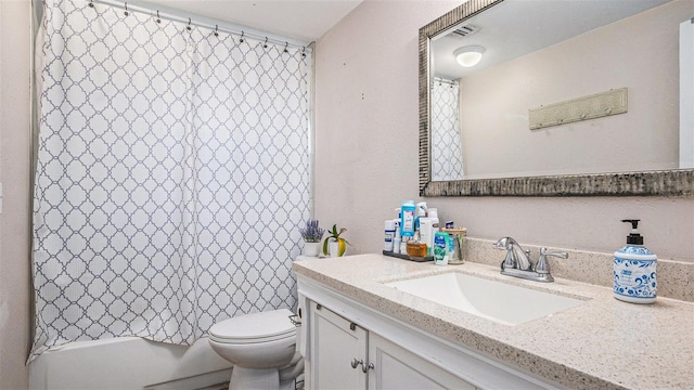 full bathroom with toilet, vanity, and shower / bath combo with shower curtain