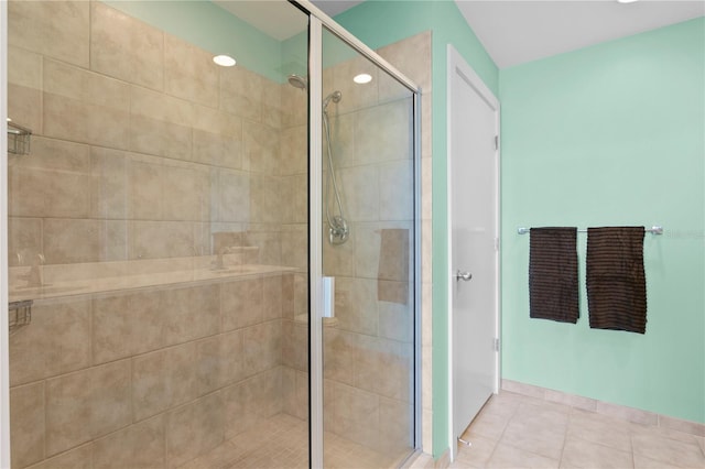 bathroom with tile patterned flooring and walk in shower