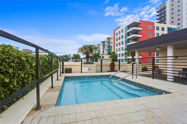 view of pool featuring a patio