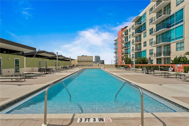 view of swimming pool with a patio