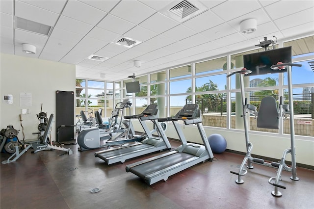 exercise room with a paneled ceiling