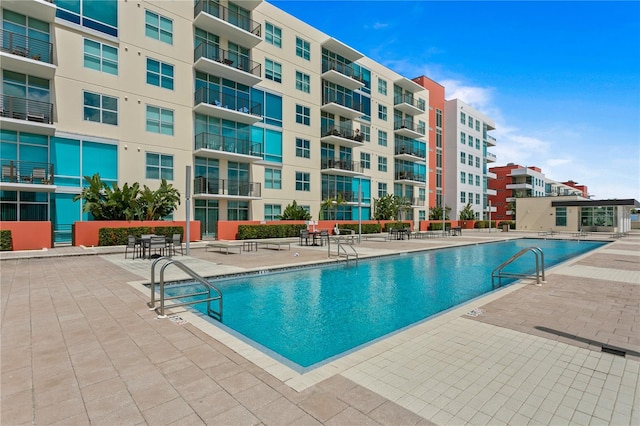 view of swimming pool with a patio area