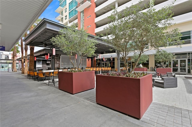 surrounding community featuring outdoor lounge area