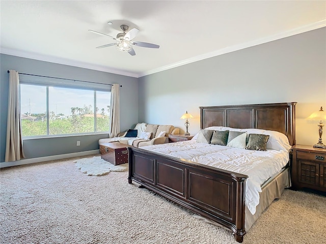 bedroom with ceiling fan, light carpet, and crown molding