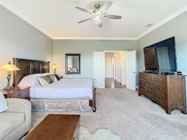 bedroom with light hardwood / wood-style floors, ceiling fan, and crown molding