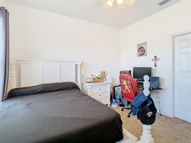 bedroom featuring ceiling fan and carpet