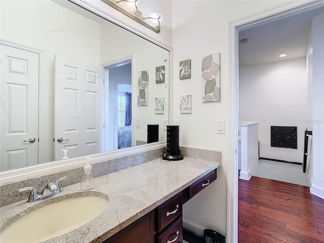 bathroom featuring vanity and hardwood / wood-style flooring