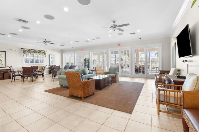 tiled living room with ornamental molding, plenty of natural light, and ceiling fan