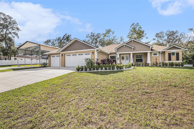 view of front facade featuring a garage, a front yard, and a carport