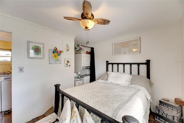 bedroom with dark hardwood / wood-style floors, ceiling fan, and crown molding