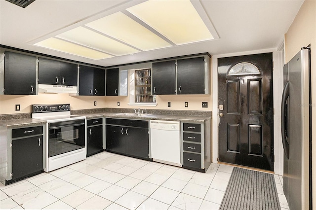 kitchen featuring range hood, white appliances, and sink