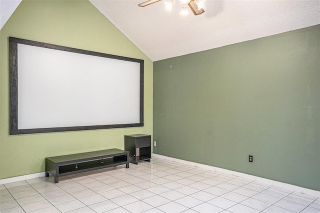 home theater room featuring light tile patterned floors, a textured ceiling, vaulted ceiling, and ceiling fan