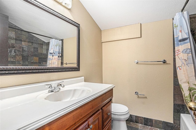 full bathroom with vanity, shower / bath combination with curtain, a textured ceiling, and toilet