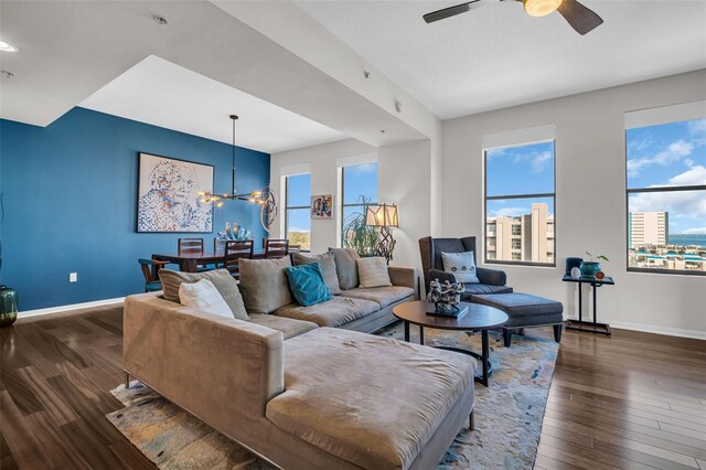 226 5th Ave N Unit 706, Saint Petersburg, FL 33701 - living area with dark wood finished floors, baseboards, and ceiling fan with notable chandelier