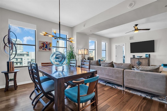 226 5th Ave N Unit 706, Saint Petersburg, FL 33701 - dining room with dark wood finished floors, visible vents, baseboards, and ceiling fan with notable chandelier