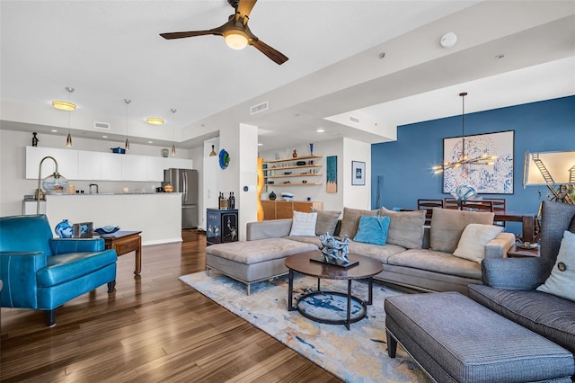 226 5th Ave N Unit 706, Saint Petersburg, FL 33701 - living area featuring wood finished floors, visible vents, and ceiling fan with notable chandelier