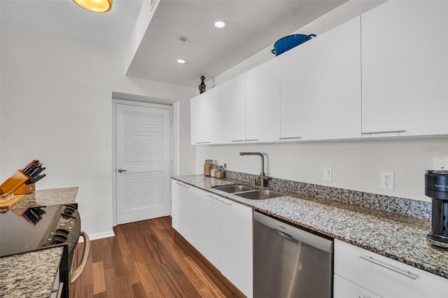 226 5th Ave N Unit 706, Saint Petersburg, FL 33701 - kitchen featuring stove, dishwasher, a sink, dark wood-type flooring, and white cabinetry