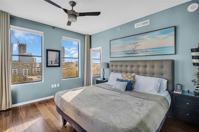 226 5th Ave N Unit 706, Saint Petersburg, FL 33701 - bedroom featuring wood finished floors, visible vents, a ceiling fan, and multiple windows