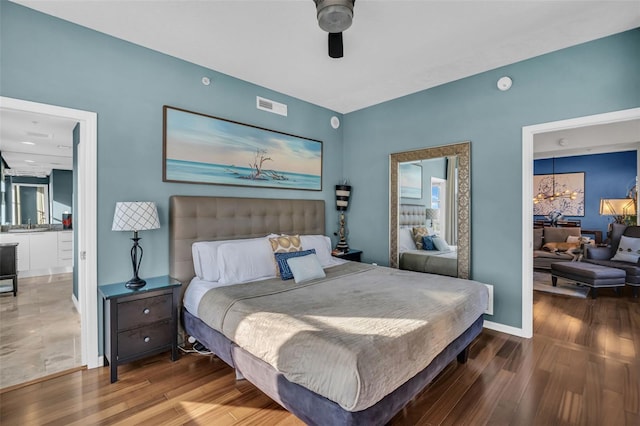 226 5th Ave N Unit 706, Saint Petersburg, FL 33701 - bedroom with visible vents, baseboards, wood finished floors, and ceiling fan with notable chandelier
