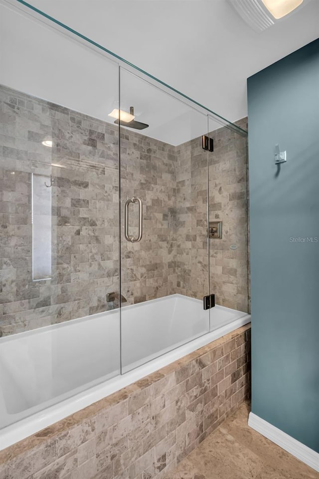 226 5th Ave N Unit 706, Saint Petersburg, FL 33701 - full bathroom with baseboards and tiled shower / bath