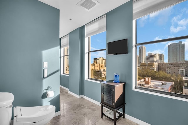 226 5th Ave N Unit 706, Saint Petersburg, FL 33701 - bathroom featuring baseboards, visible vents, and toilet
