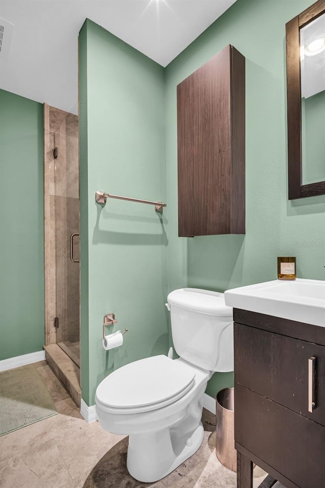 226 5th Ave N Unit 706, Saint Petersburg, FL 33701 - bathroom with a shower stall, vanity, toilet, and baseboards