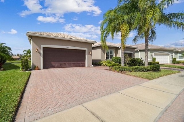 view of front facade featuring a front yard and a garage