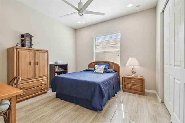 bedroom with ceiling fan and a closet