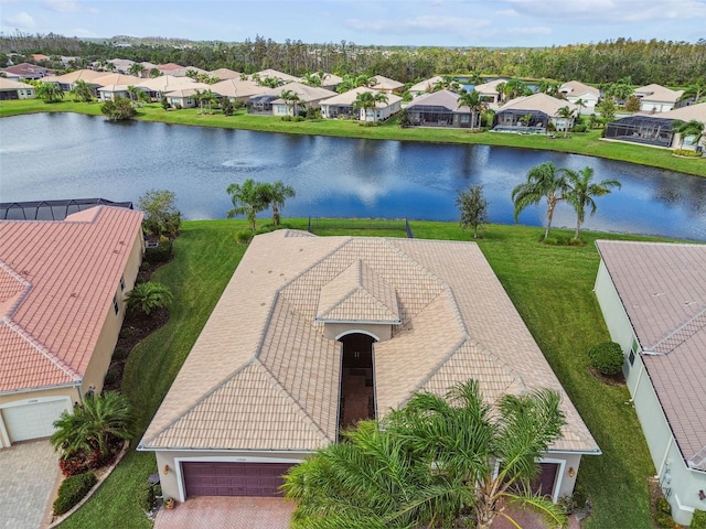 birds eye view of property with a water view