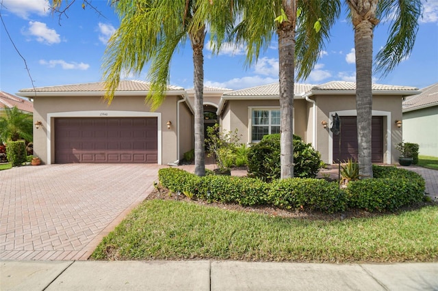 view of front of property with a garage