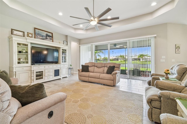 tiled living room with a raised ceiling